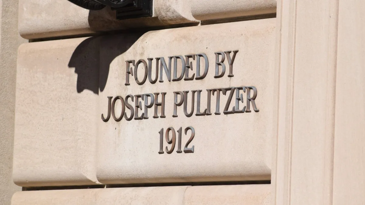 Text on the exterior of Pulitzer Hall that reads "Founded by Joseph Pulitzer 1912."