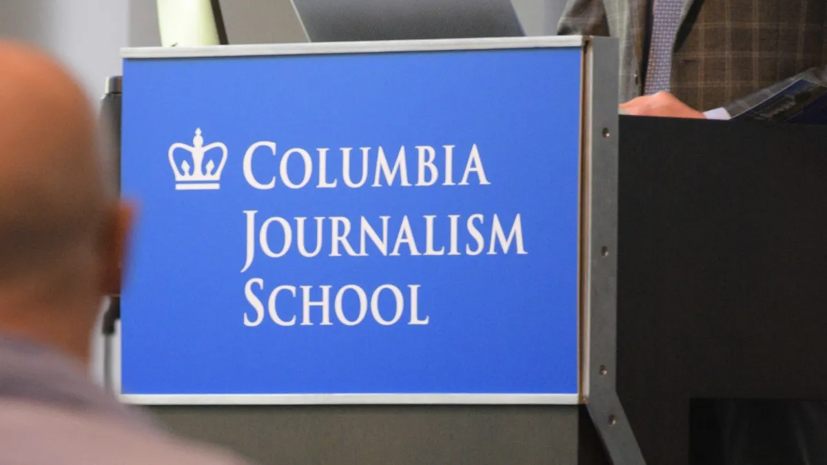 Podium featuring the Columbia Journalism School logo. 