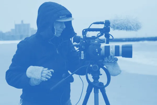 A student recording video at Coney Island. 