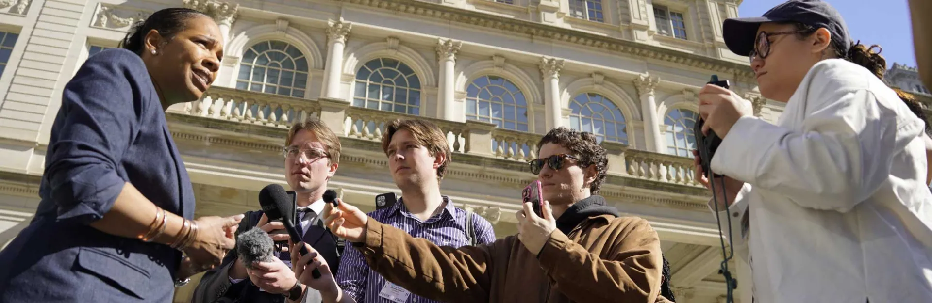 Students interview a NYC City Council Member outside City Hall. 